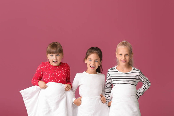 Cute little girls with blanket on color background - Fotoğraf, Görsel