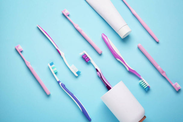Set of toothbrushes on color background - Photo, Image