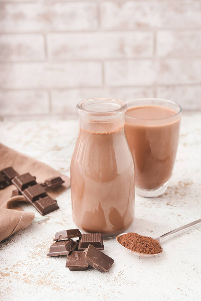 Bottle of aromatic chocolate milk on table - Foto, Imagem
