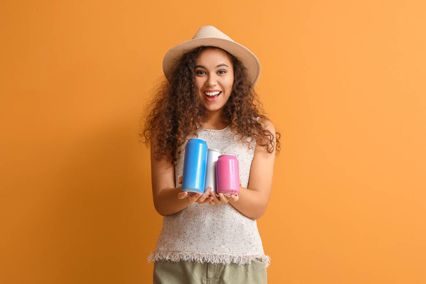 Beautiful African-American woman with soda on color background - Photo, Image