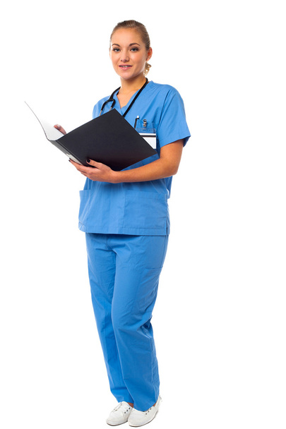 Female doctor reviewing reports - Φωτογραφία, εικόνα