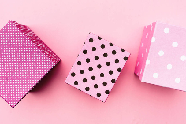 Gift boxs on paste pink background. - Fotografie, Obrázek