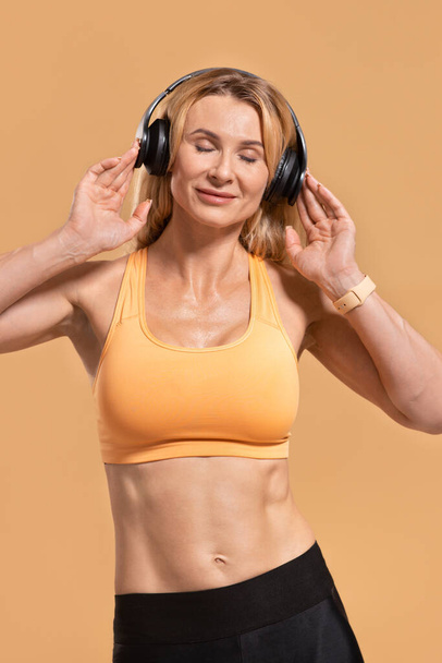 Enjoy music and exercise in middle age at home alone - Photo, Image