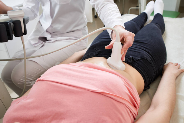 Female gynecologist doctor operating ultrasound scanner - Фото, зображення