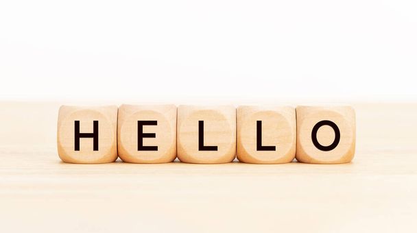 Hello word in wooden blocks on table. White background. Copy space - Foto, imagen