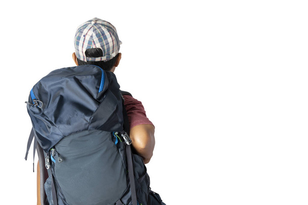 Asian man in casual t-shirt wearing and cap with backpack ready to travel for his holidays isolated on blue background with copy space. clipping paths. - Fotografie, Obrázek