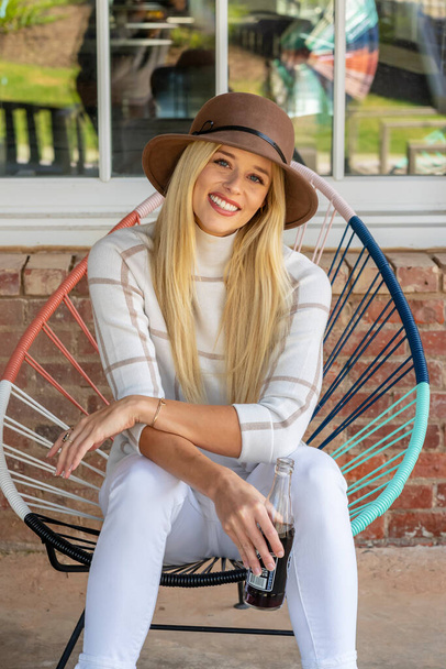A gorgeous blonde model poses outdoors in her fall clothes - Zdjęcie, obraz