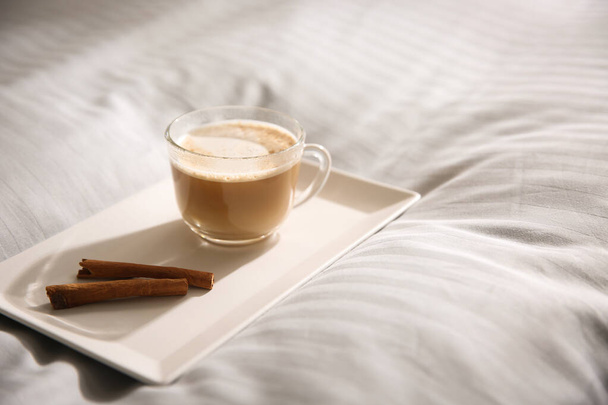 Tray with morning coffee on soft blanket. Space for text - 写真・画像
