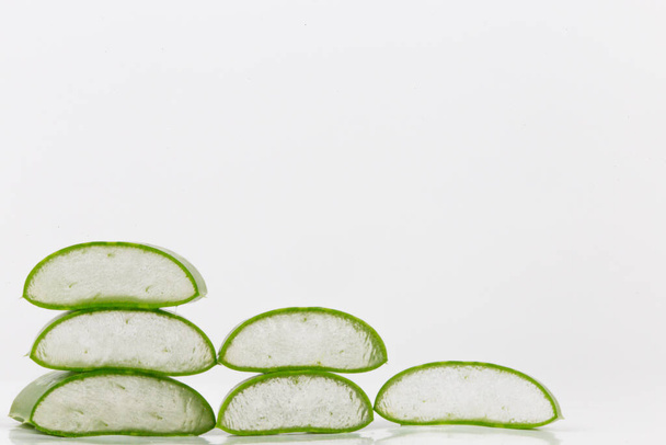 Fresh aloe vera leaves on white background. It is a natural preparation for beauty and skin care and is also used in nutrition. - Photo, Image