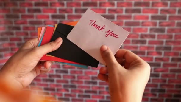 rear view of womens hand holding thank you letter - Footage, Video