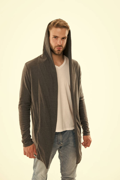 Fashion trend. Street style outfit. Handsome man with hood standing white background. Clothes daily wear. Menswear concept. Casual and comfortable. Male fashion influencer. Fashionable model man - Foto, afbeelding