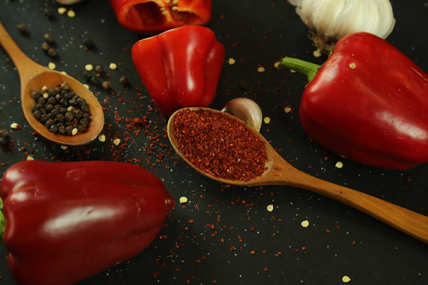 Red peppers on black background - Zdjęcie, obraz