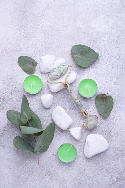 Green jade facial roller for skincare - Photo, Image