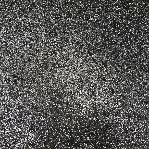 Czarny brokat w tle. Genialna abstrakcyjna powierzchnia pyłu. Shimmer hologram kryształu tekstury. Świąteczne tło blasku. - Zdjęcie, obraz