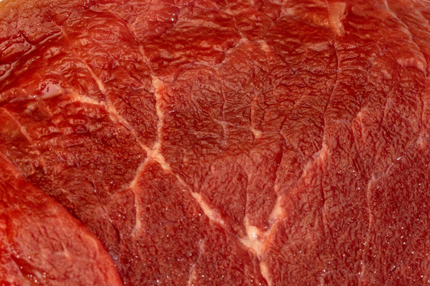 Fresh raw red meat texture closeup, marbled meat - Фото, изображение