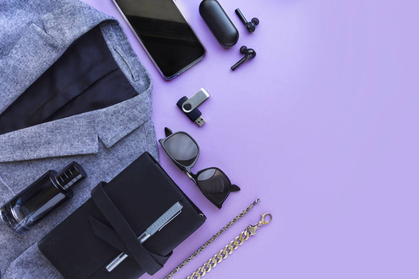 Mens accessories, notebook, airpods, sunglasses, car model on lilac background. Top view, flat lay. - Valokuva, kuva
