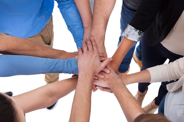 Group of people stacking hands together - Foto, Bild