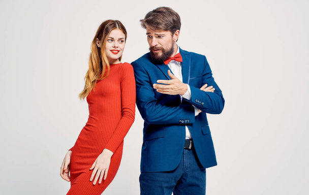 Woman in red dress and man in suit emotions family luxury studio - Photo, Image
