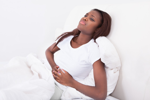 Woman Suffering From Stomachache In Bed - Fotó, kép