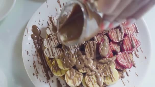 Pancakes with Chocolate, Nuts and Bananas. Stack of whole flapjack.  - Footage, Video