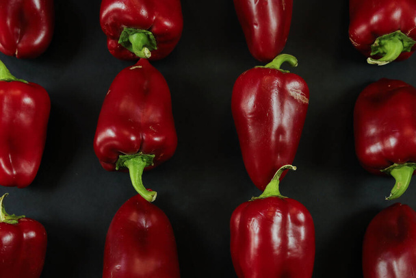 Red peppers on black background - Photo, Image