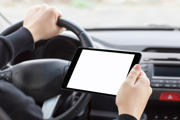 man sitting in the car and holding a tablet with isolated screen - Foto, Bild