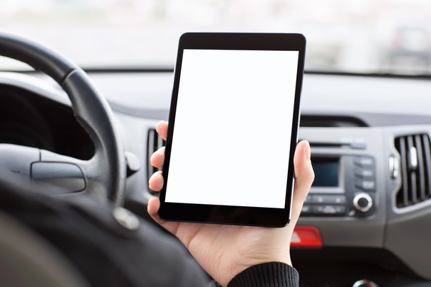 man sitting in the car and holding a tablet with isolated screen - Foto, immagini