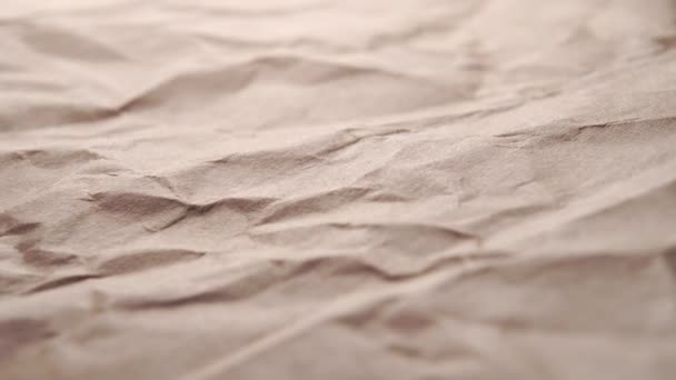 Crumpled craft wrapping paper, wrinkled texture. Dolly shot - Footage, Video