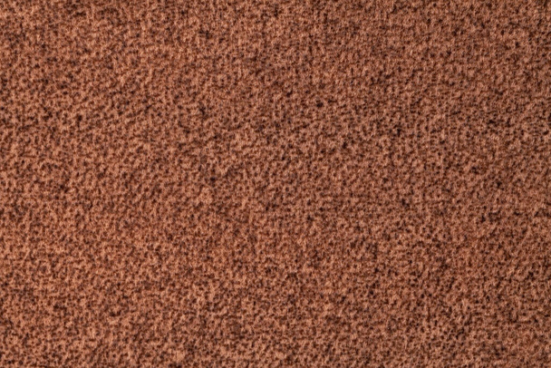 Fondo mullido marrón oscuro de suave tejido de terciopelo. Textura de fondo textil de lana umber, primer plano. - Foto, Imagen
