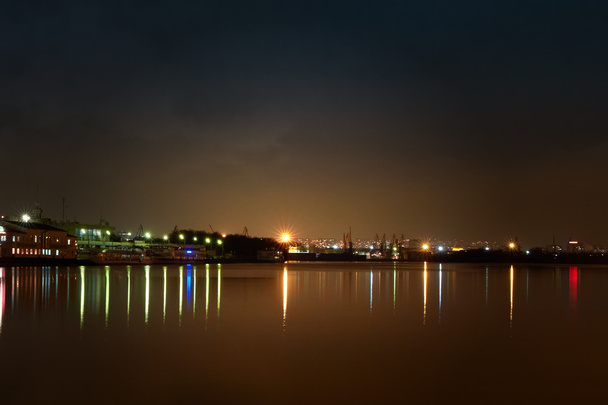 City at night. Port cranes and river - 写真・画像