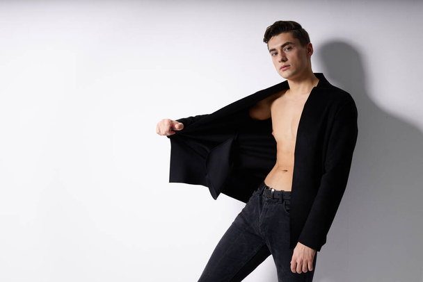 man in black unbuttoned blazers fashion posing Studio modern style - Zdjęcie, obraz