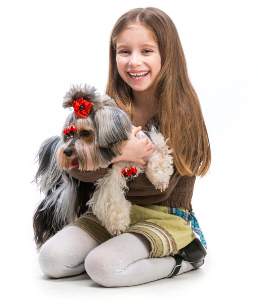 little girl is with her dog Yorkshire Terrier - Fotó, kép