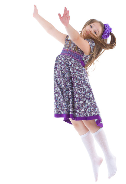 girl jumping spinning and waving hands - Foto, imagen
