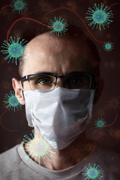 Adult man wearing hygienic mask to prevent infection, airborne respiratory illness such as flu, 2019-nCoV on dark background. Healthcare concept. - Zdjęcie, obraz