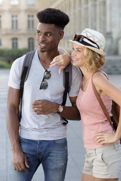 ethnically diverse couple sight seeing together - Фото, зображення