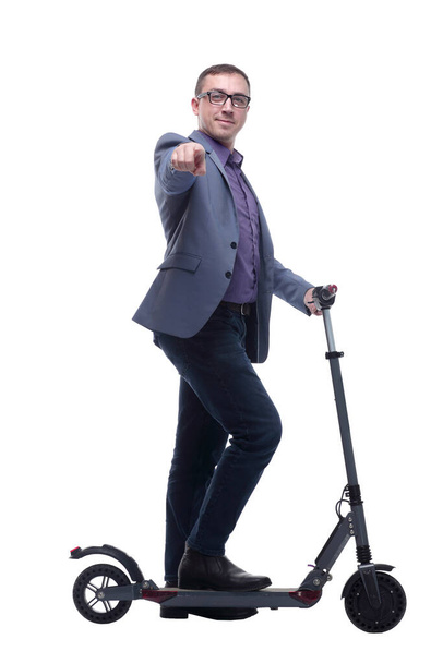Pleasant smiling man riding a kick scooter - Photo, Image