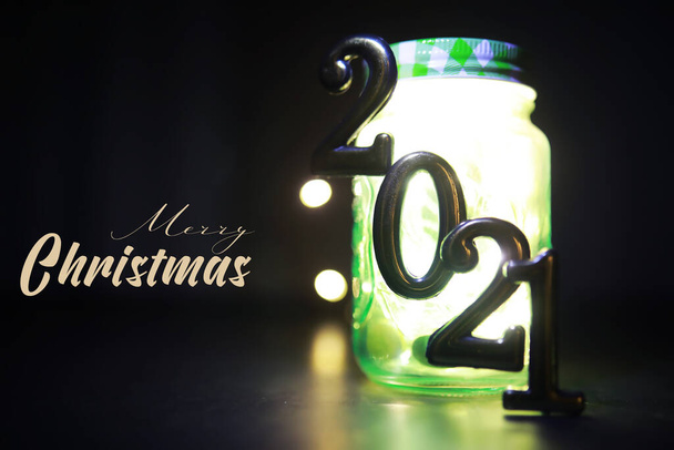 Holiday led light garland in jar. Christmas, new year holiday celebration concept. Copy space. Banner image for design - Photo, Image
