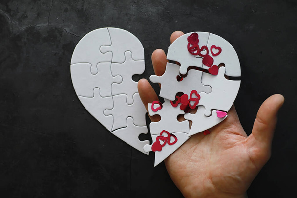 White heart-shaped puzzle. Heart affairs. Undivided love. Broken heart. The key to the heart. Closed heart on a lock. Concept love. - Photo, Image