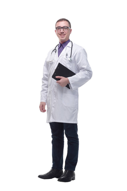 Full length portrait of a medical doctor wearing glasses and holding a clipboard - Foto, imagen