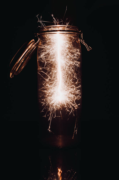 A vertical shot of abstract white lights in a glass can - Valokuva, kuva