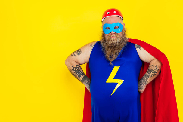 Funny man wearing a superhero costume - Fotó, kép