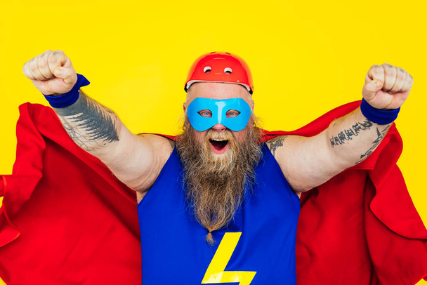 Funny man wearing a superhero costume - Фото, изображение