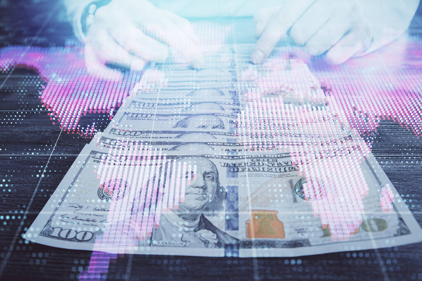 Multi exposure of financial theme drawing hologram and USA dollars bills and man hands. Business concept. - Fotoğraf, Görsel