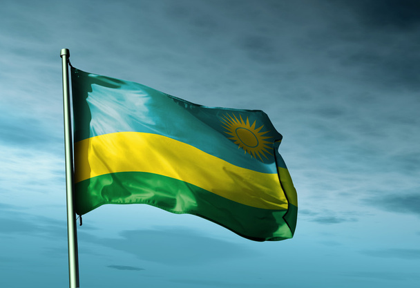 ルワンダの旗が風に手を振っています。 - 写真・画像