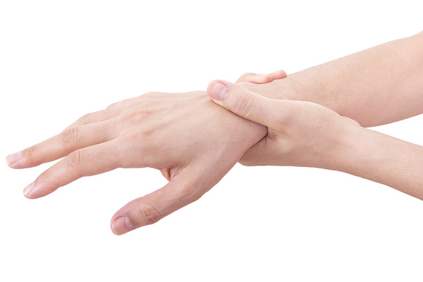  Egy nő tartja a csuklóját. Fájdalomelmélet. A nő kéz a kézben tartja a csuklófájdalmat. Office szindróma.Csuklófájdalom.  - Fotó, kép