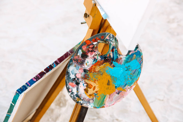close-up shot of painting tools covered with colorful paint - Photo, Image