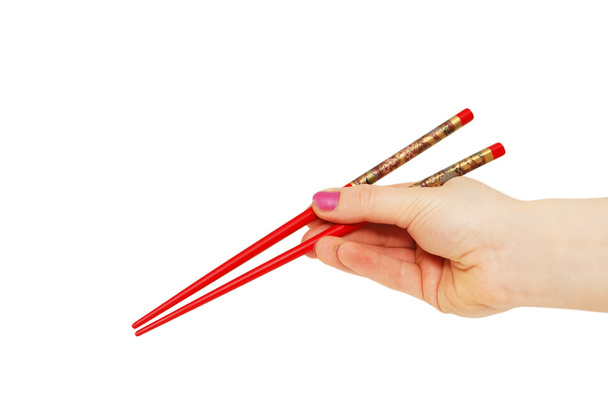 Hand with chopsticks isolated on the white - Photo, Image