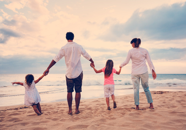 Family Having Fun on Beach at Sunset - Foto, Imagen
