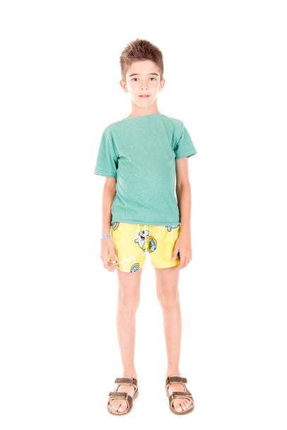 little boy with beach shorts isolated in white background - Φωτογραφία, εικόνα
