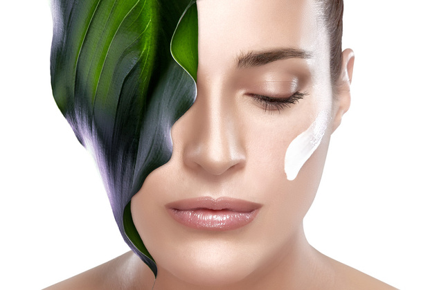 Beautiful Spa Girl with Leaf on Her Face. Skincare concept - Photo, Image
